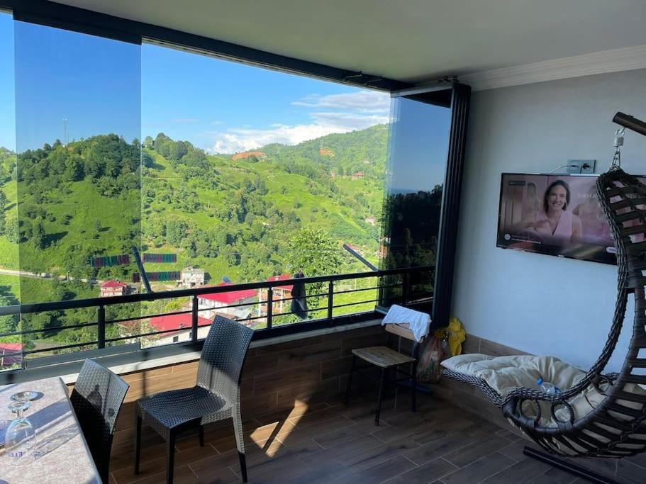 a room with a large window with a view of a mountain at Aile ye uygun doğayla iç içe in Pazar