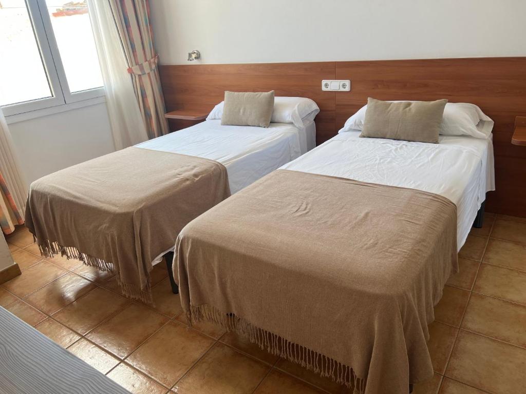 Postel nebo postele na pokoji v ubytování Vehí