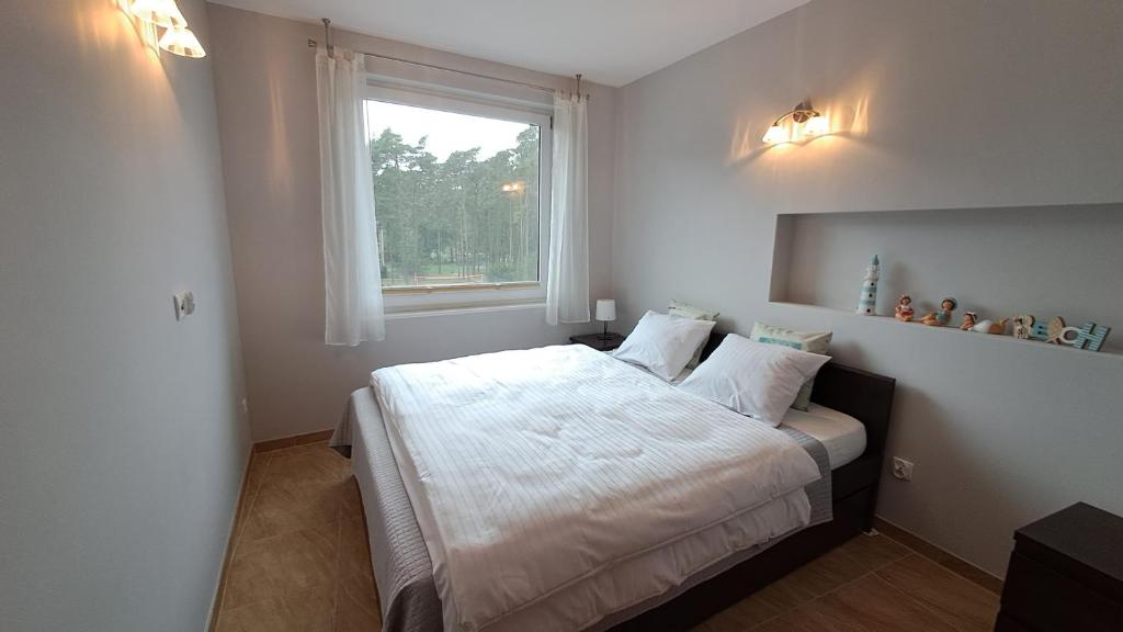 Postel nebo postele na pokoji v ubytování Komfortowy Apartament w Blue Mare