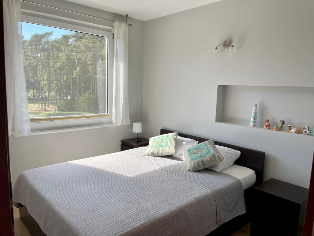 Postel nebo postele na pokoji v ubytování Komfortowy Apartament w Blue Mare