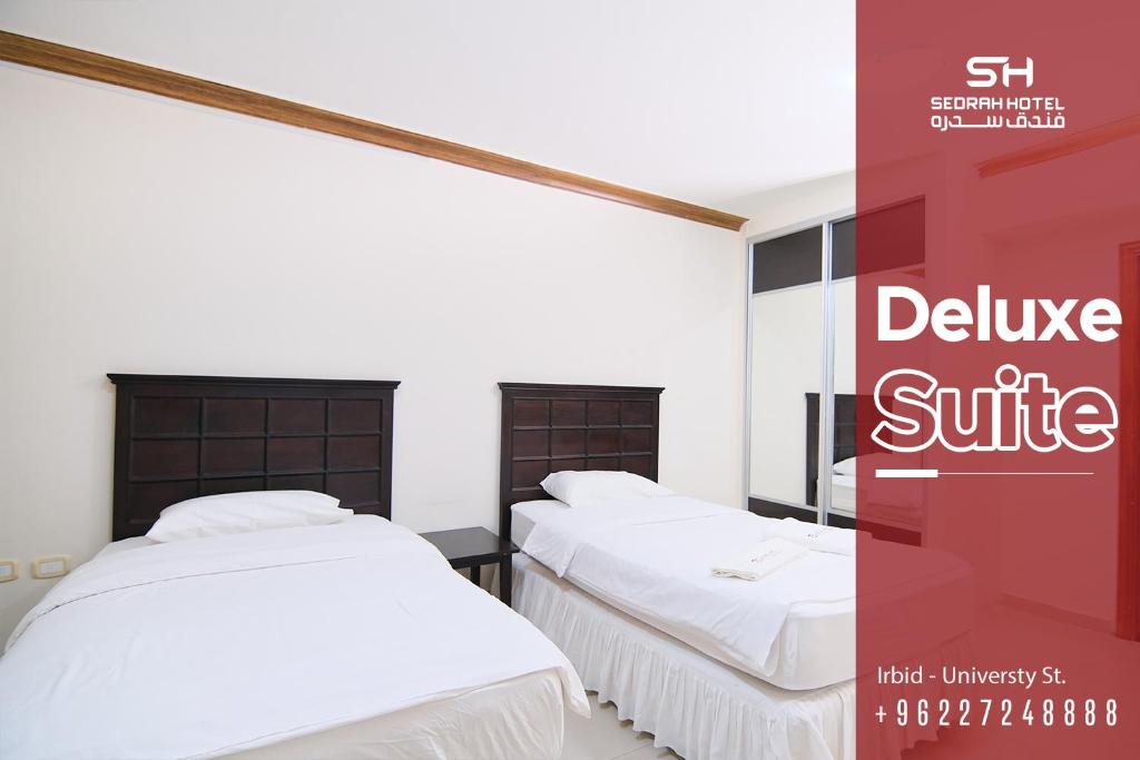 Postel nebo postele na pokoji v ubytování Sedrah Hotel