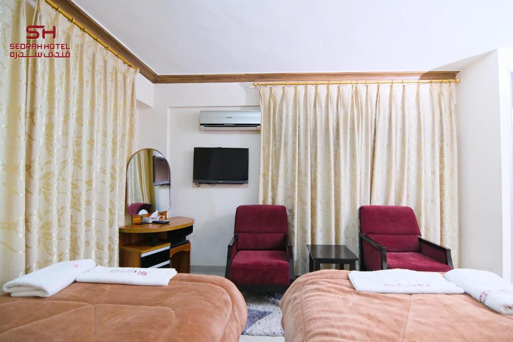 TV a/nebo společenská místnost v ubytování Sedrah Hotel