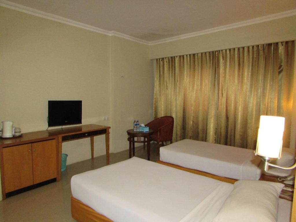 TV a/nebo společenská místnost v ubytování Hotel Wisata