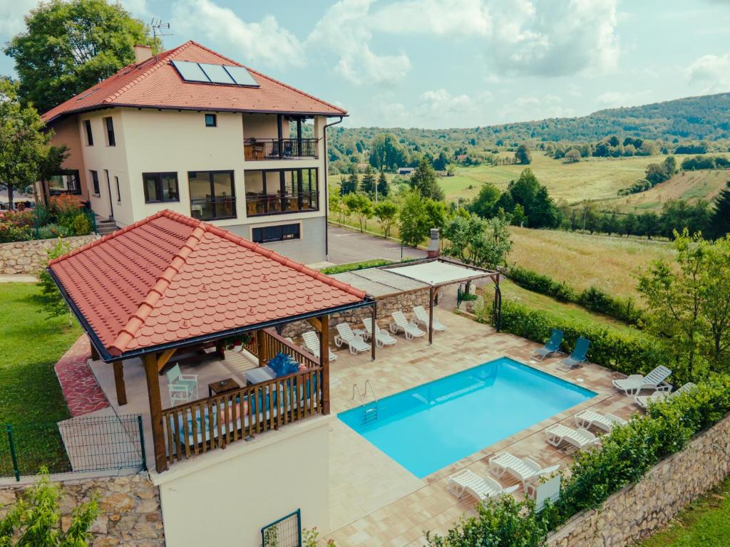 an aerial view of a house with a swimming pool at Jankovi Dvori in Rakovica