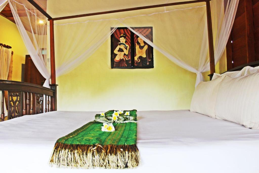 Postel nebo postele na pokoji v ubytování Pai Vimaan Resort
