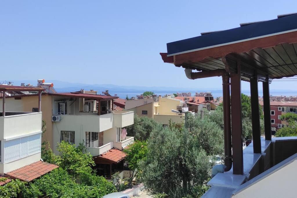 a view from the balcony of a building at Altınoluk ta deniz ve doğa manzaralı 3 oda salon in Edremit