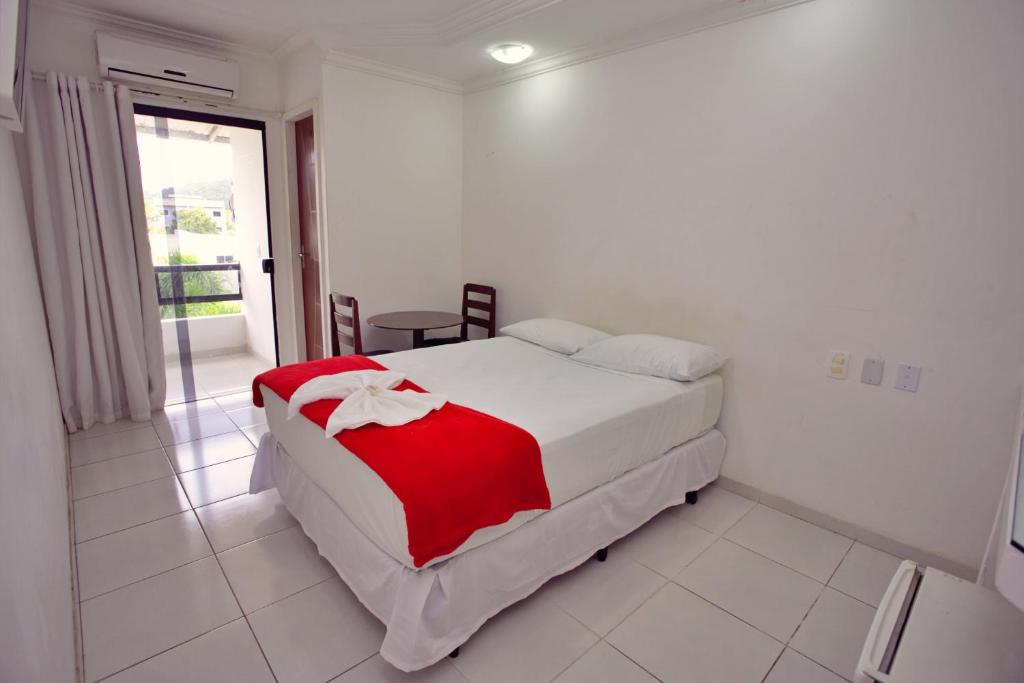 Postel nebo postele na pokoji v ubytování Pousada Paulett's - Hospedagem na Zona Norte de Ilhéus - Bahia