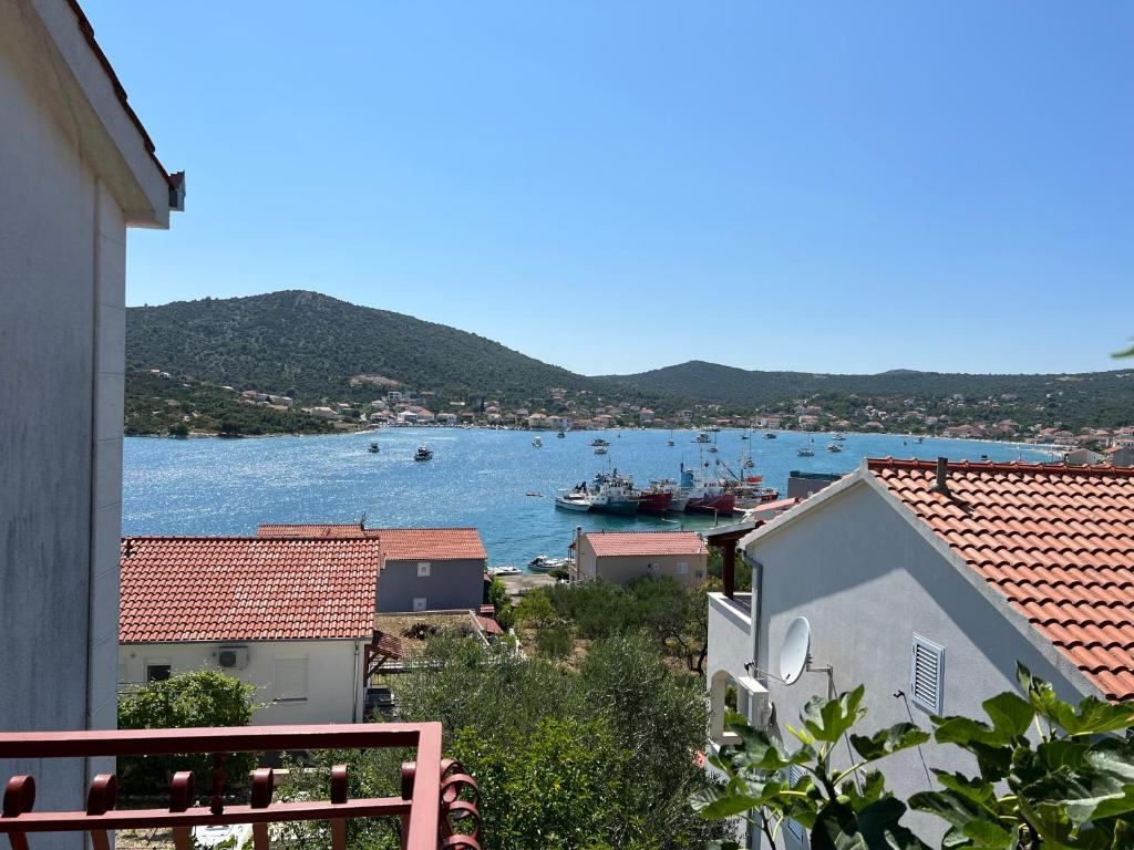a view of a harbor with boats in the water at Apartment Kustura in Vinišće