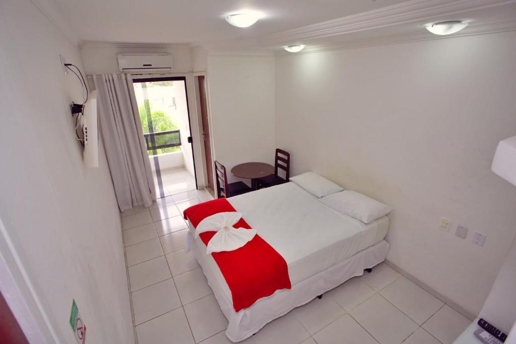 Postel nebo postele na pokoji v ubytování Pousada Paulett's - Hospedagem na Zona Norte de Ilhéus - Bahia