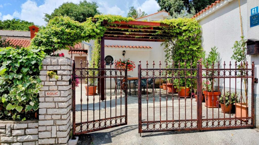 an entrance to a house with an iron gate at Nadia's house in Pićan