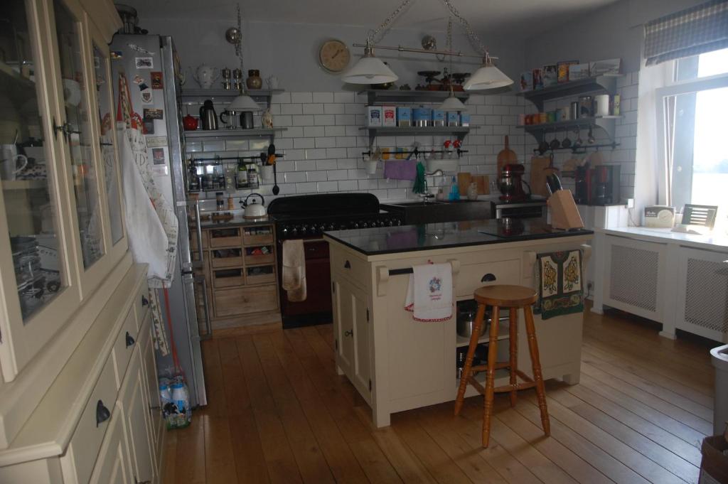 a kitchen with a sink and a counter top at Le Buisson B&amp;B in Gouvy