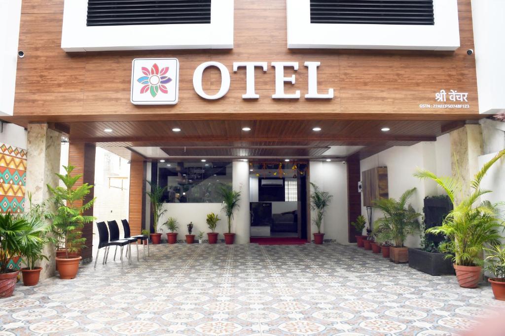 an office building with a sign that reads united at Otel in Nagpur