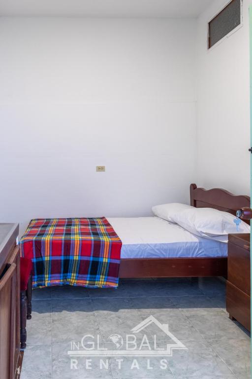 Postel nebo postele na pokoji v ubytování Sandalio Hostal Cali