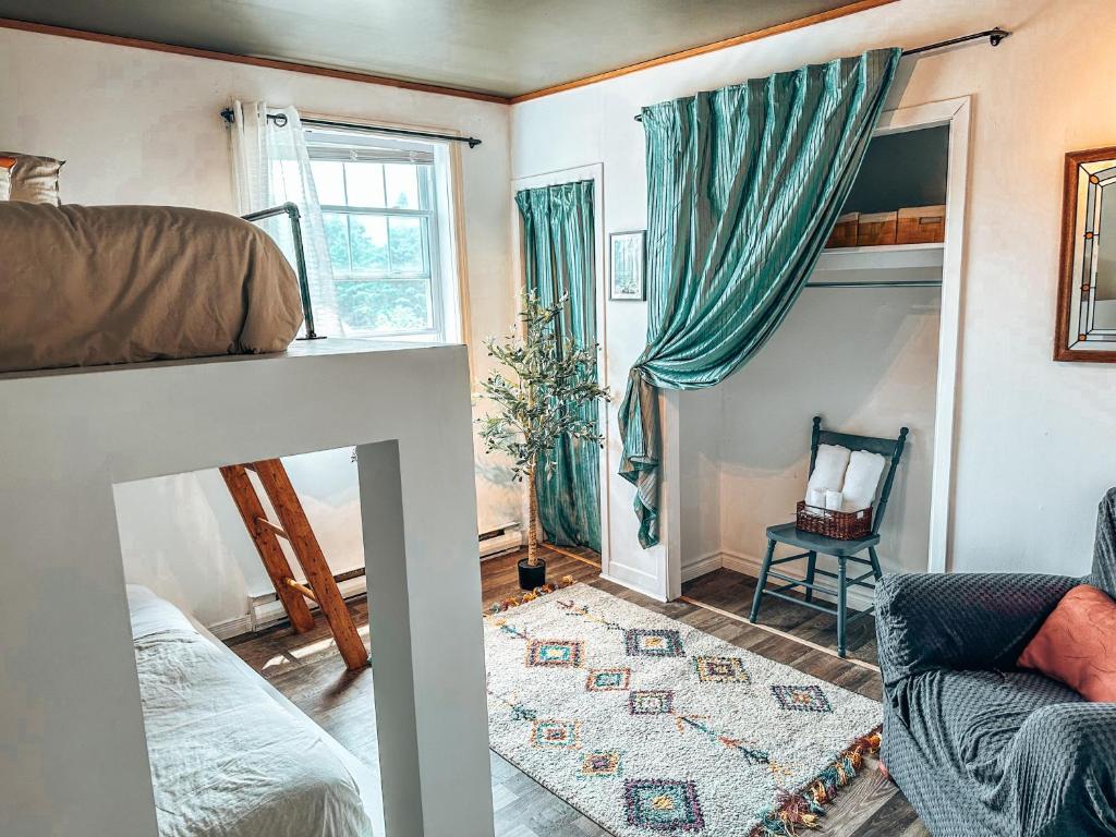 Postel nebo postele na pokoji v ubytování Auberge Mandala