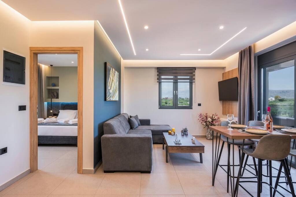 a living room with a couch and a table at Aspect Luxury Apartment I in Galangádhos