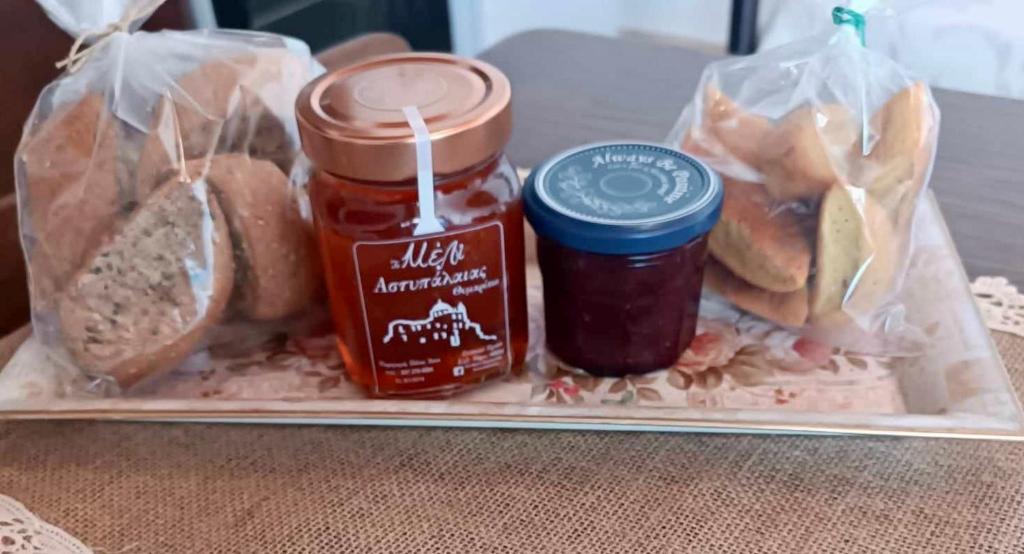 a lunch box with a sandwich and jam and pickles at Queen Stampalia in Astypalaia Town