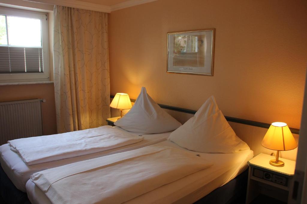 Postel nebo postele na pokoji v ubytování Hotel Nordic
