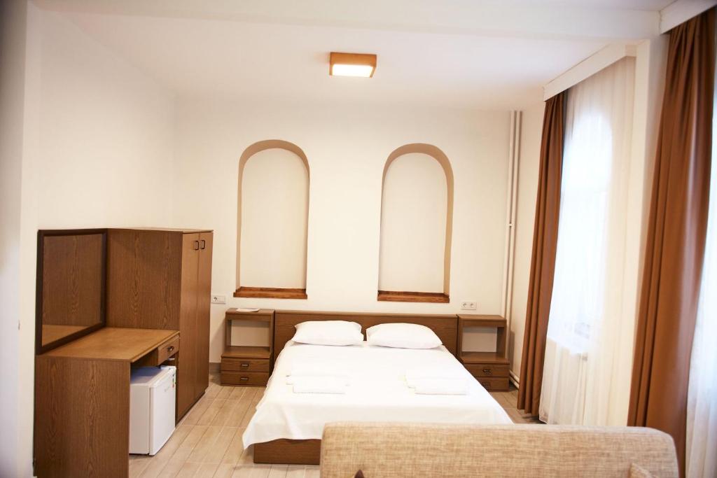 Postel nebo postele na pokoji v ubytování İlçayto Suites