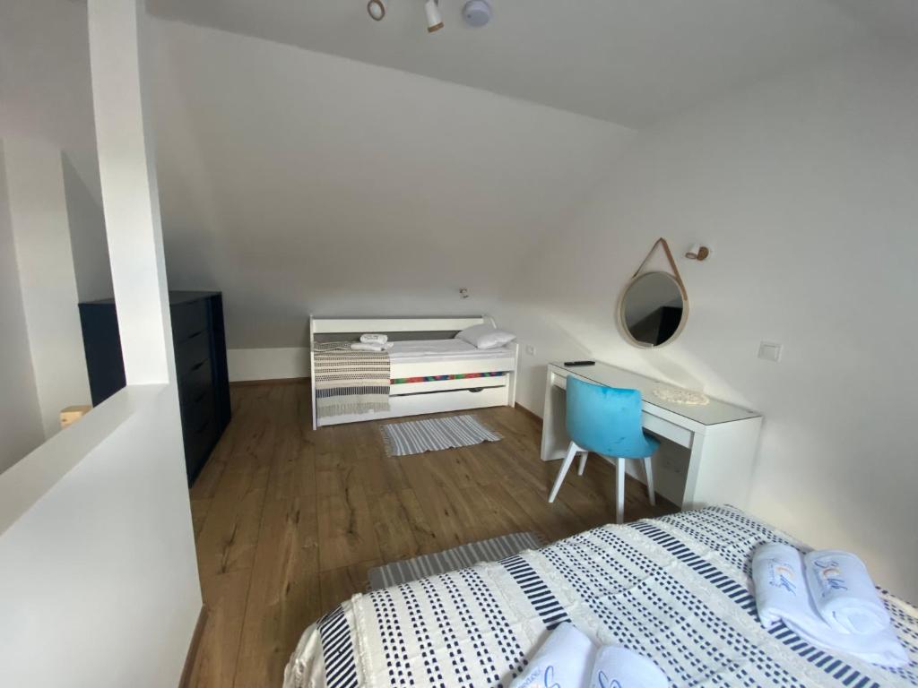 Postel nebo postele na pokoji v ubytování SOLEK Apartamenty i pokoje gościnne