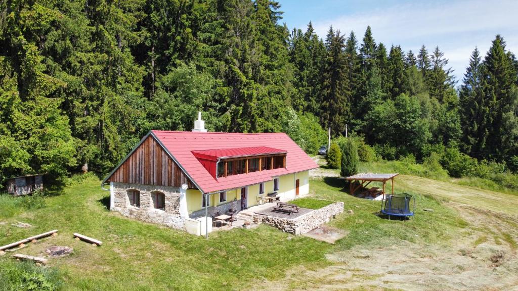 an aerial view of a house with a red roof at chalupa Račov in Zdíkov