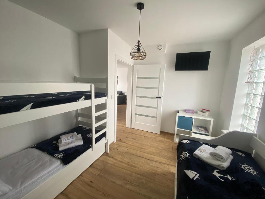 Postel nebo postele na pokoji v ubytování SOLEK Apartamenty i pokoje gościnne