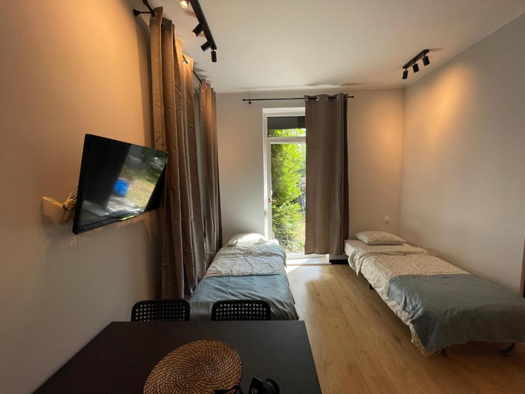 Łóżko lub łóżka w pokoju w obiekcie Vacation Apartments Sopot