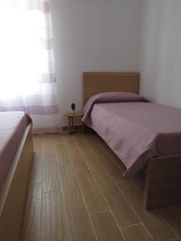 Postel nebo postele na pokoji v ubytování Tanufé Casa Vacanze