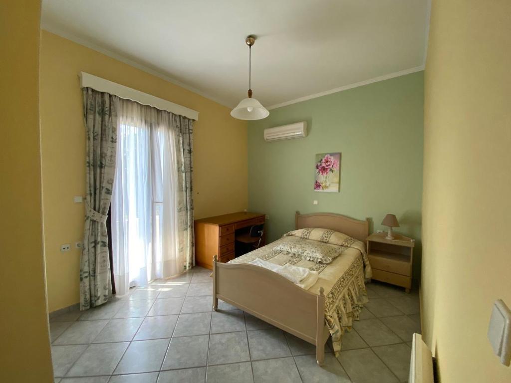 Łóżko lub łóżka w pokoju w obiekcie Villa Dalia