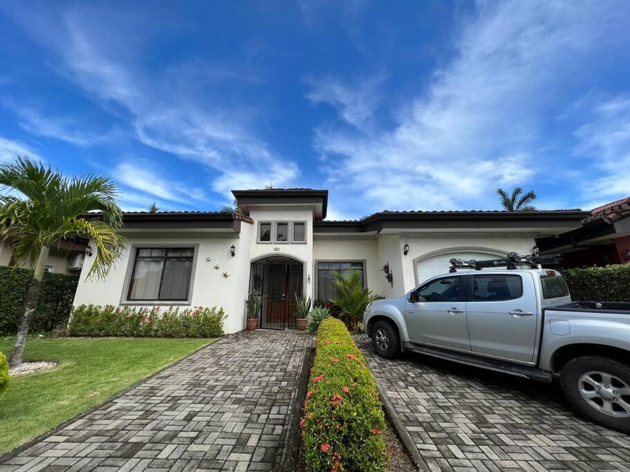 a white truck parked in front of a house at Casa Famari at Playa Bejuco in Bejuco