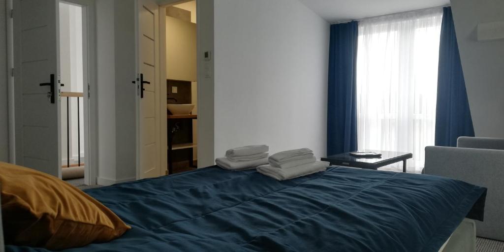 Postel nebo postele na pokoji v ubytování Mazuria Inulec