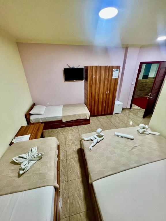 Postel nebo postele na pokoji v ubytování Hotel Atika
