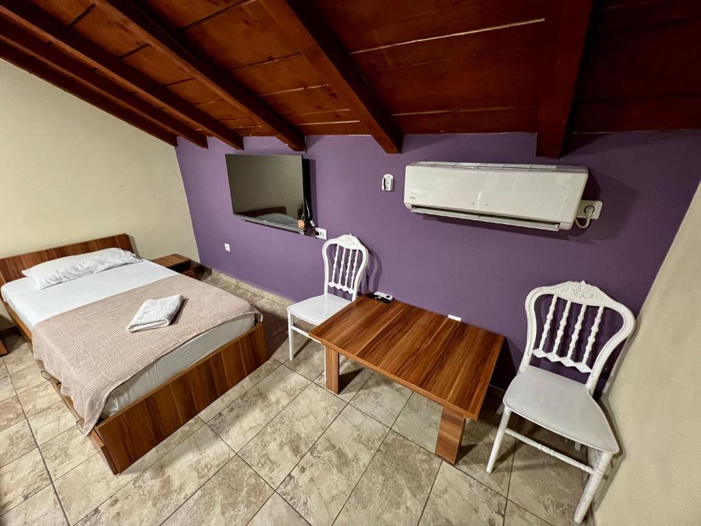 Postel nebo postele na pokoji v ubytování Hotel Atika