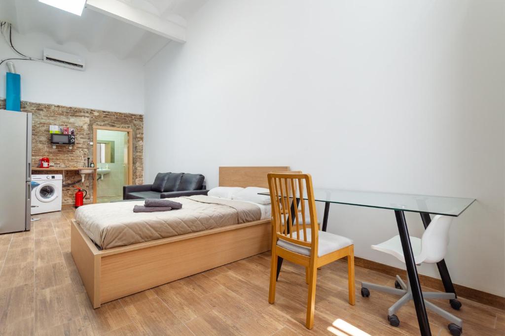 Postel nebo postele na pokoji v ubytování CAMP NOU & FiRA BUSINESS LOFTS