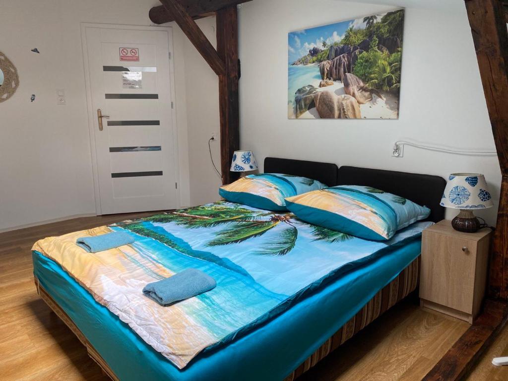Postel nebo postele na pokoji v ubytování Sea world Apartments Mansarda