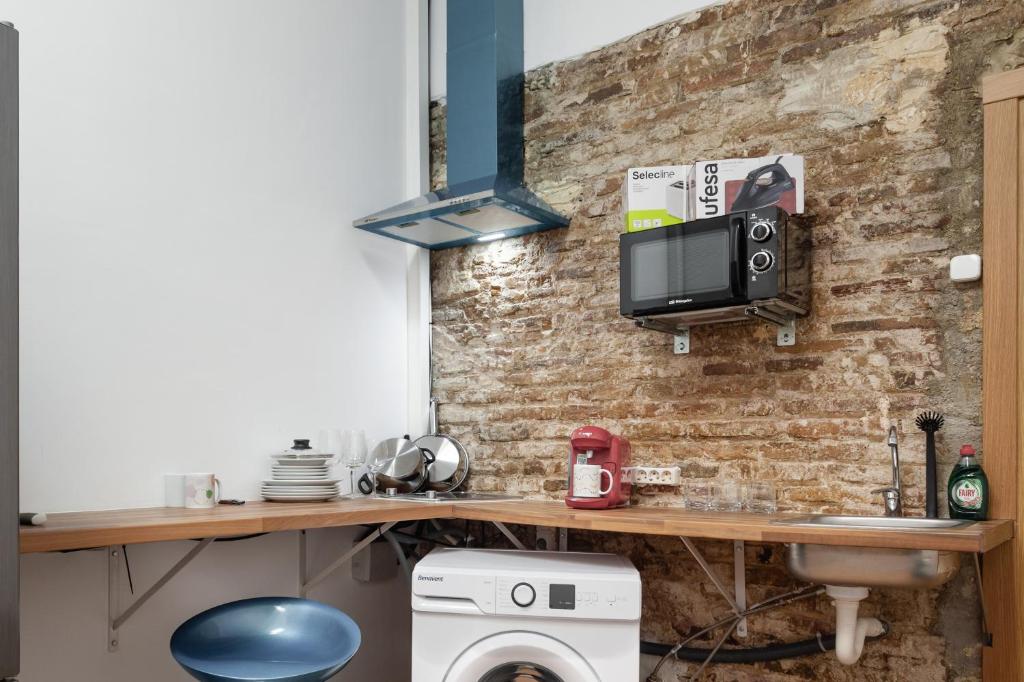 Kuchyň nebo kuchyňský kout v ubytování CAMP NOU & FiRA BUSINESS LOFTS