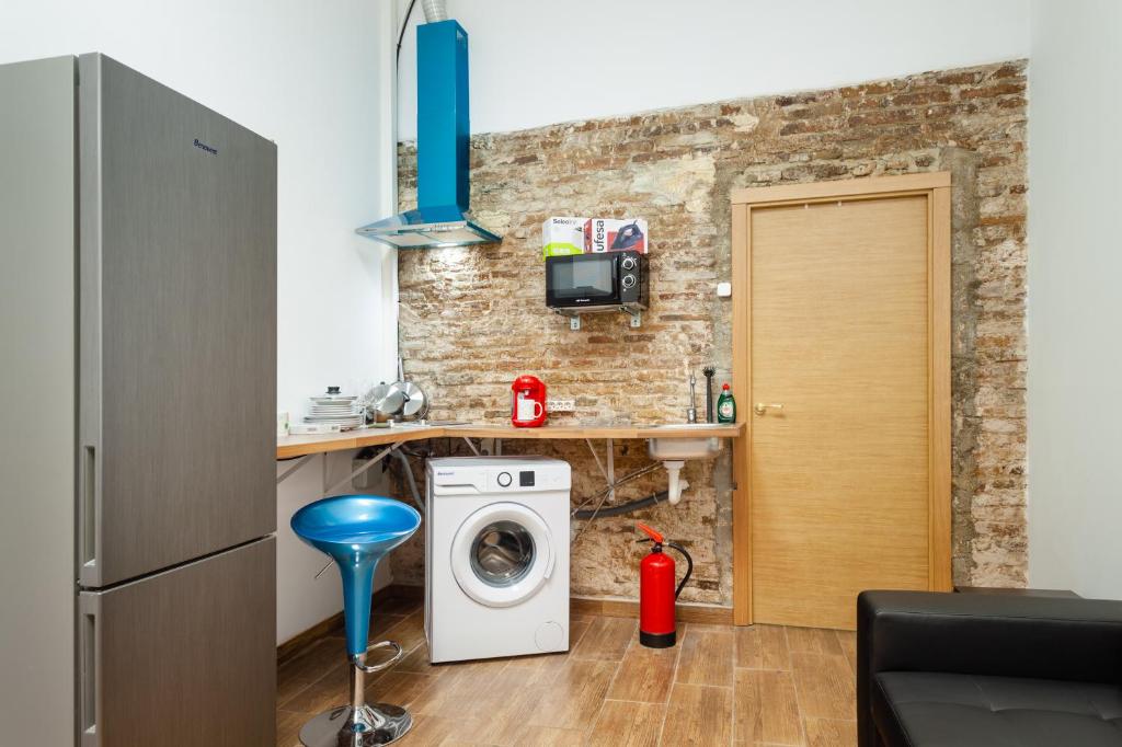 Kuchyň nebo kuchyňský kout v ubytování CAMP NOU & FiRA BUSINESS LOFTS