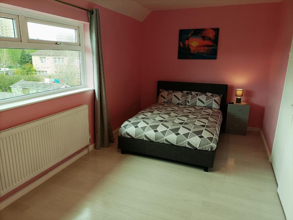 a small bedroom with a bed and a window at Pace home in Bristol