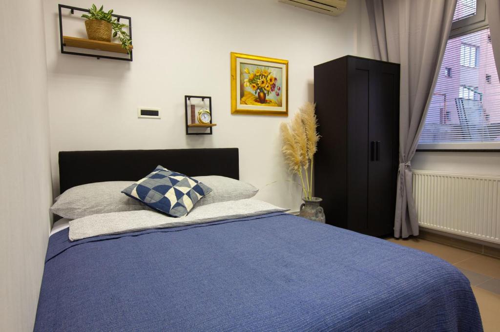 Een bed of bedden in een kamer bij H3 Zagreb