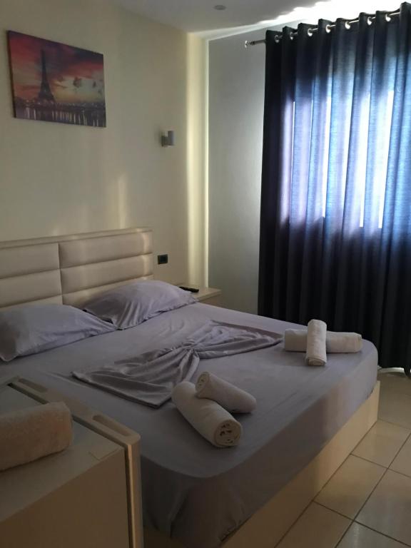 Postel nebo postele na pokoji v ubytování HOTEL SARDA