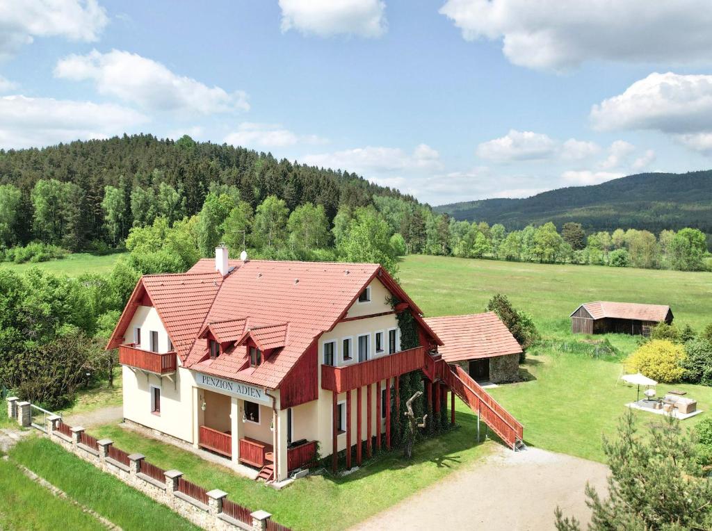 an aerial view of a house with a red roof at Penzion Adien in Chvalšiny