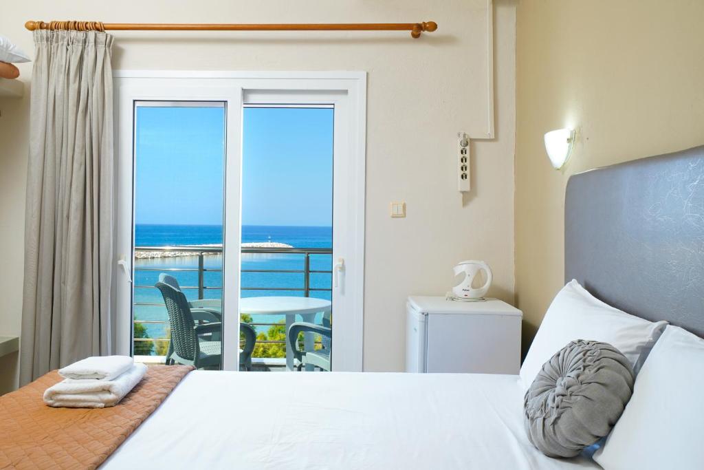 Postel nebo postele na pokoji v ubytování Hotel Papageorgiou