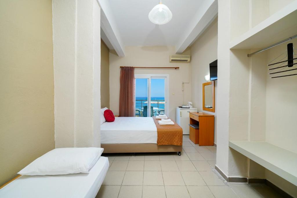 Postel nebo postele na pokoji v ubytování Hotel Papageorgiou