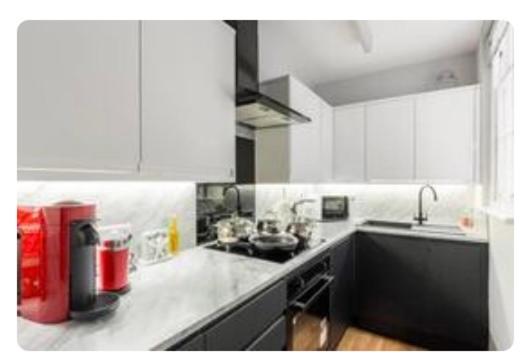 Hotel Liverpool Georgian Quarter 1 Bed Apartment Sleeps 4, a kitchen with white cabinets and a counter top at Liverpool Georgian Quarter 1 Bed Apartment Sleeps 4 in Liverpool