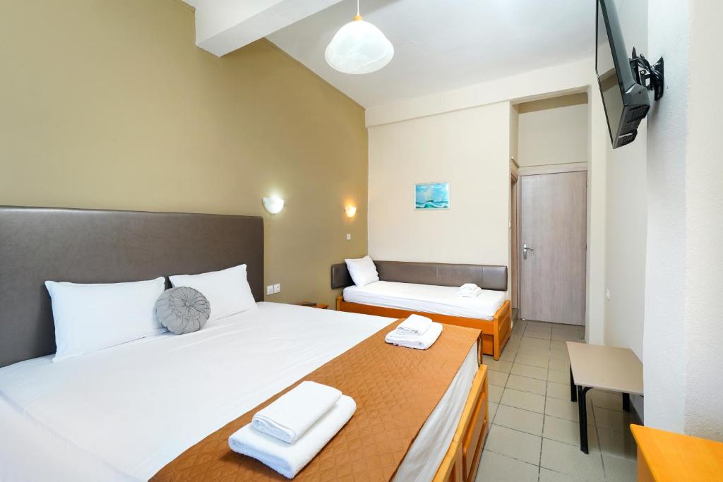 Postel nebo postele na pokoji v ubytování Hotel Papageorgiou