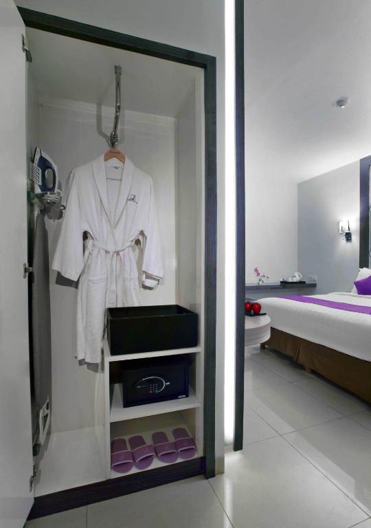 Postel nebo postele na pokoji v ubytování Quest Hotel Balikpapan by ASTON