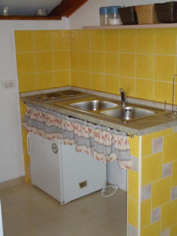 a kitchen with a sink and a counter top at Studio Apartment Nera in Rovinj