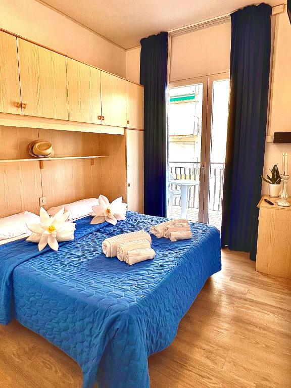 Łóżko lub łóżka w pokoju w obiekcie Hotel Trovatore