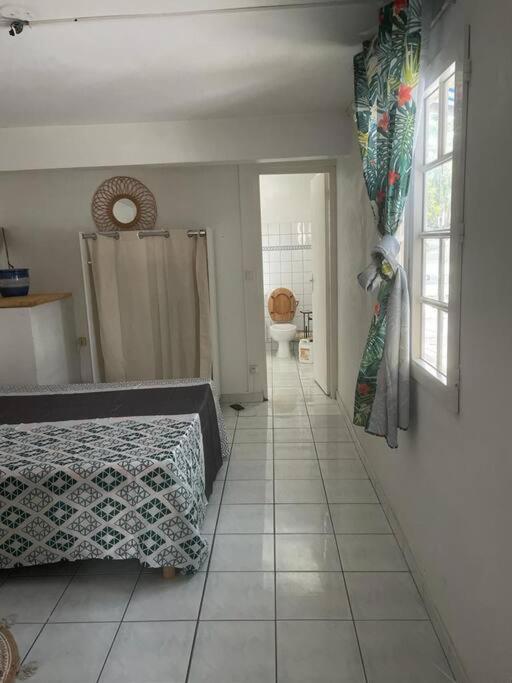 Postel nebo postele na pokoji v ubytování Soanna - Appartement à 5 minutes à pied de la plage