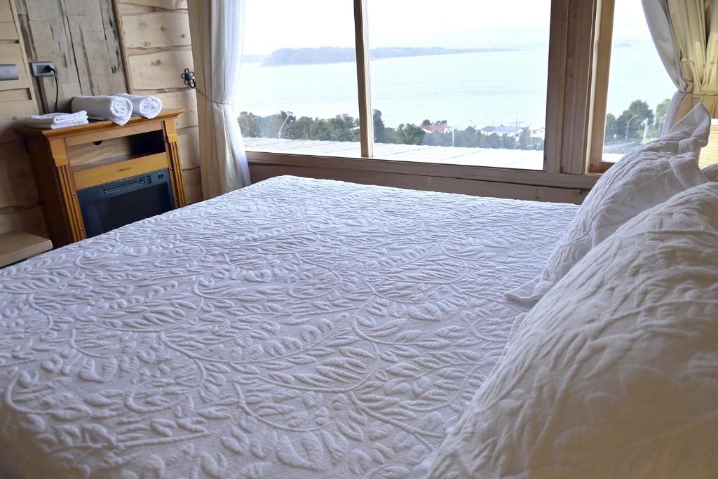 Postel nebo postele na pokoji v ubytování Hotel Boutique Antukenu