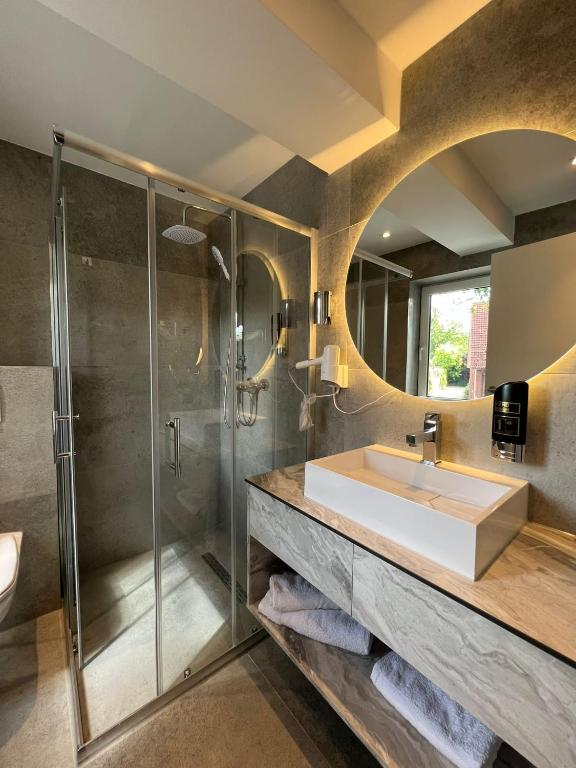 Koupelna v ubytování Hotel Harmshof Bispingen
